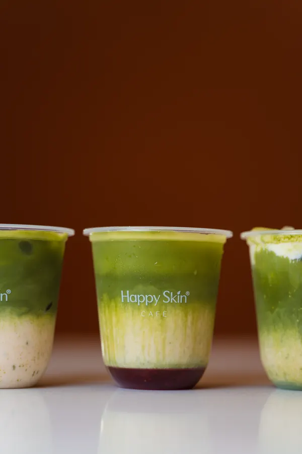 Row of layered matcha drinks