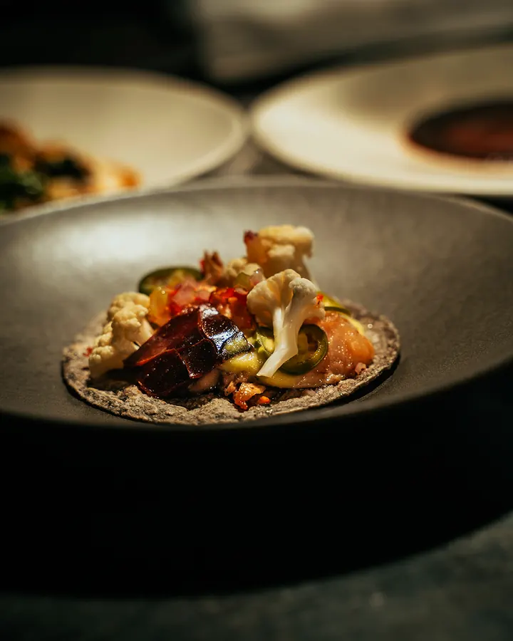 Dish in a dark ceramic bowl