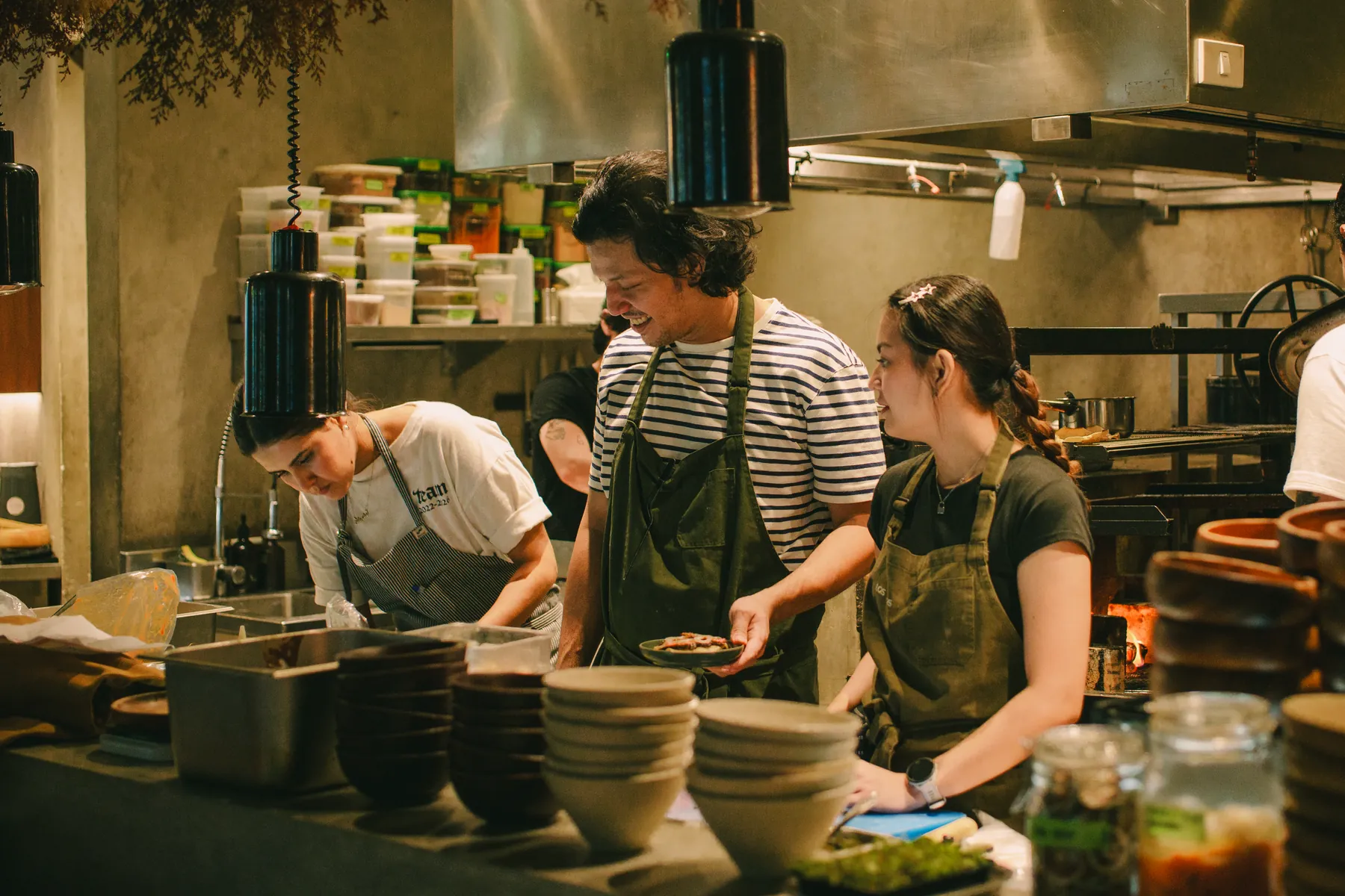 Cooks working side by side in the open kitchen