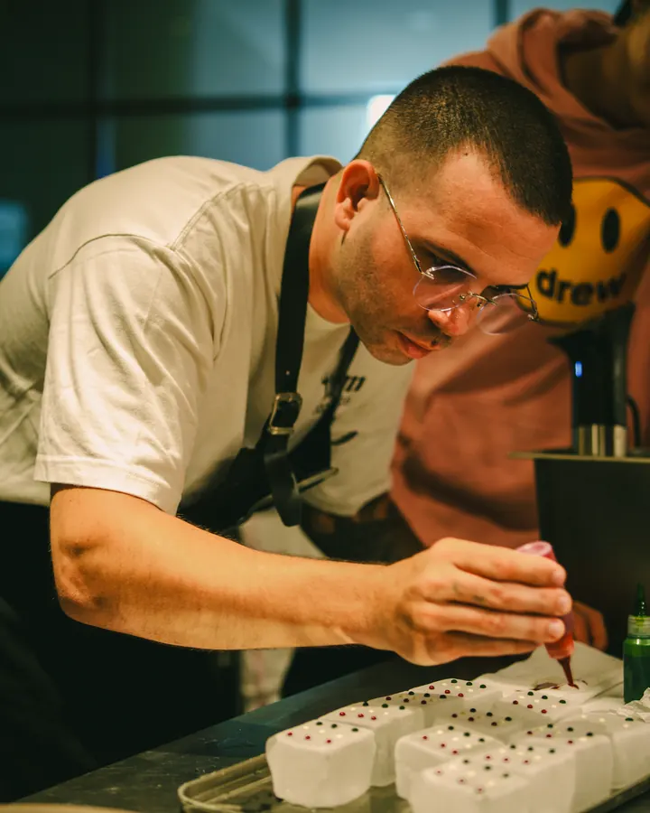 Chef concentrating while finishing a dish