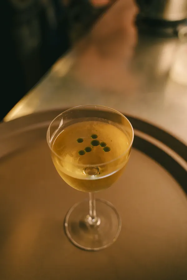 Pale cocktail in a coupe glass