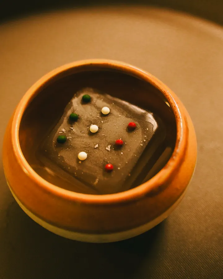 Clear jelly cube in a terracotta bowl