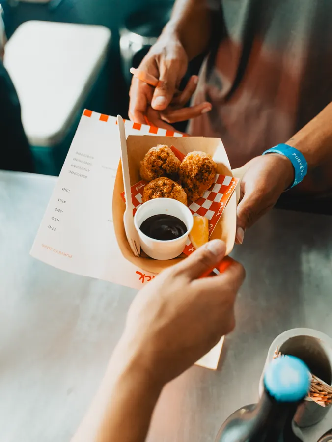 Fried chicken handed over the counter