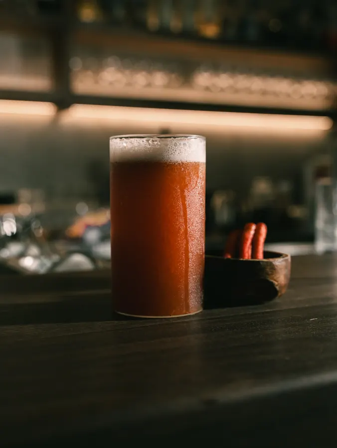 Tall red cocktail on the bar